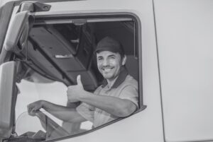 Truck driver who knows how to make a job offer giving a thumbs up