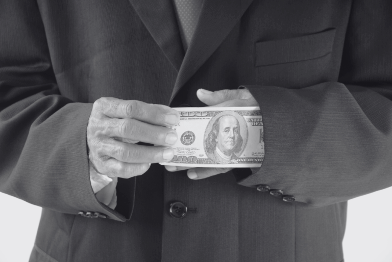 Man pulling dollar out of sleeve representing the hidden cost of internal recruitment vs rpo