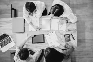 Recruitment team doing a recruitment audit at business table