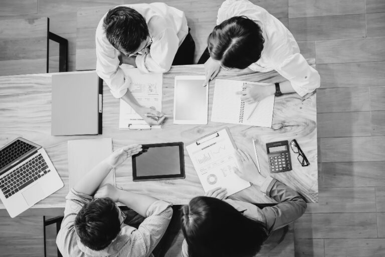 Recruitment team doing a recruitment audit at business table